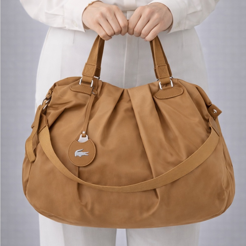 Authentic Lacoste Tan Duffel / Shoulder Bag – Excellent Pre-Owned Condition - Picture 2 of 12